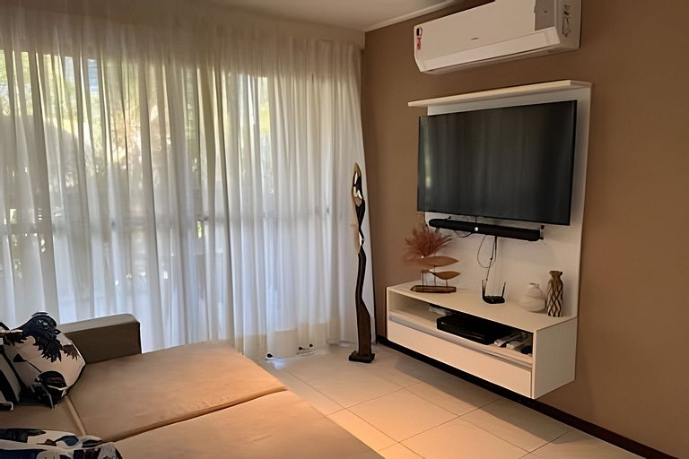 Beachfront Apartment in a Condo with Balcony