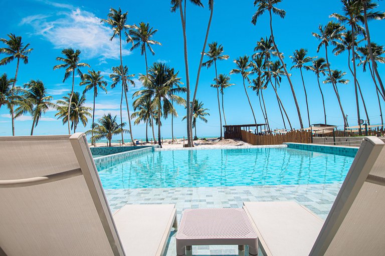 Apartamento a pie de playa en resort con piscina privada por